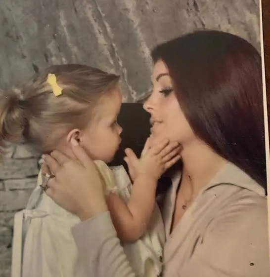 Priscilla and Lisa Marie Presley sharing a tender moment